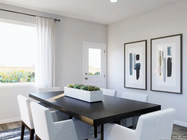 a kitchen with a table and chairs in it