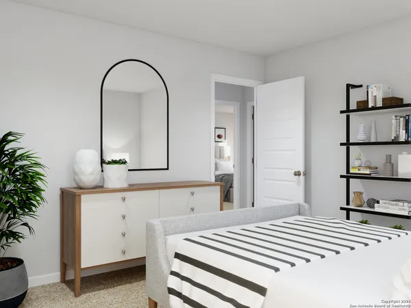 a view of a hallway to a window and an empty room