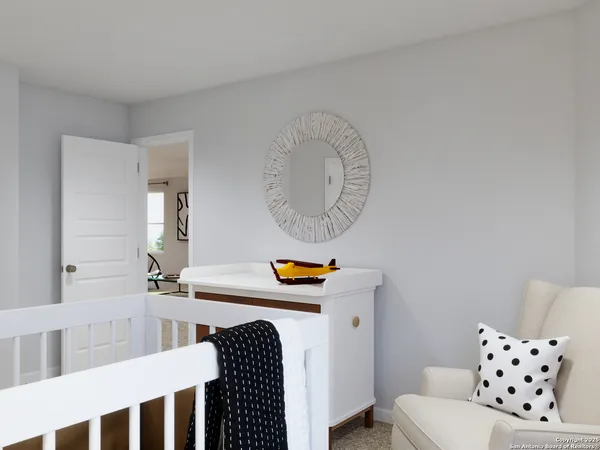 a bedroom with bed and painting on the wall