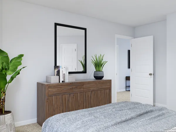 a bathroom with a granite countertop sink and a toilet