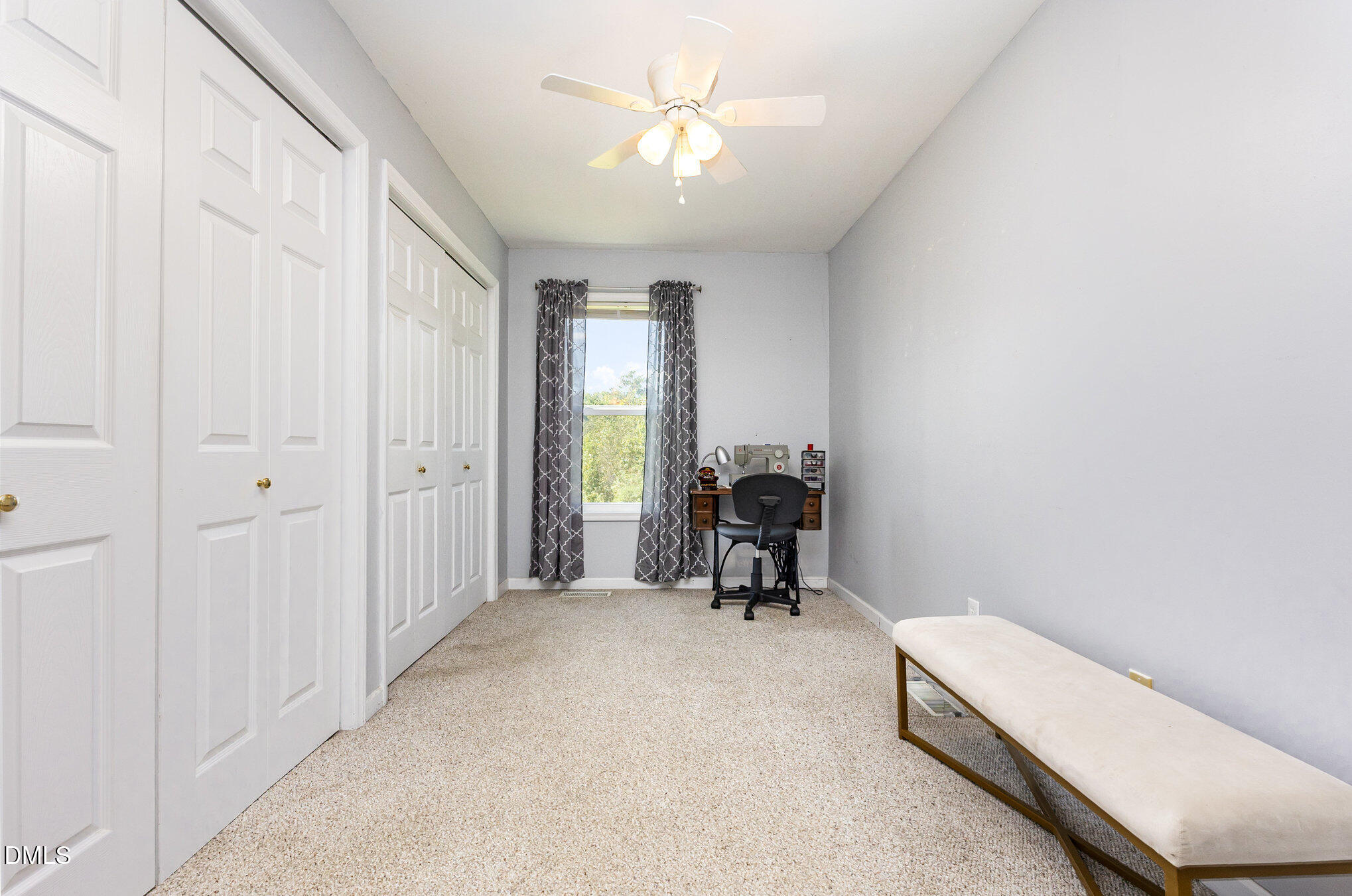 365 Landmark Road Willow Spring, NC 27592 - Photo 14 of 27 a view of a room with furniture and a ceiling fan