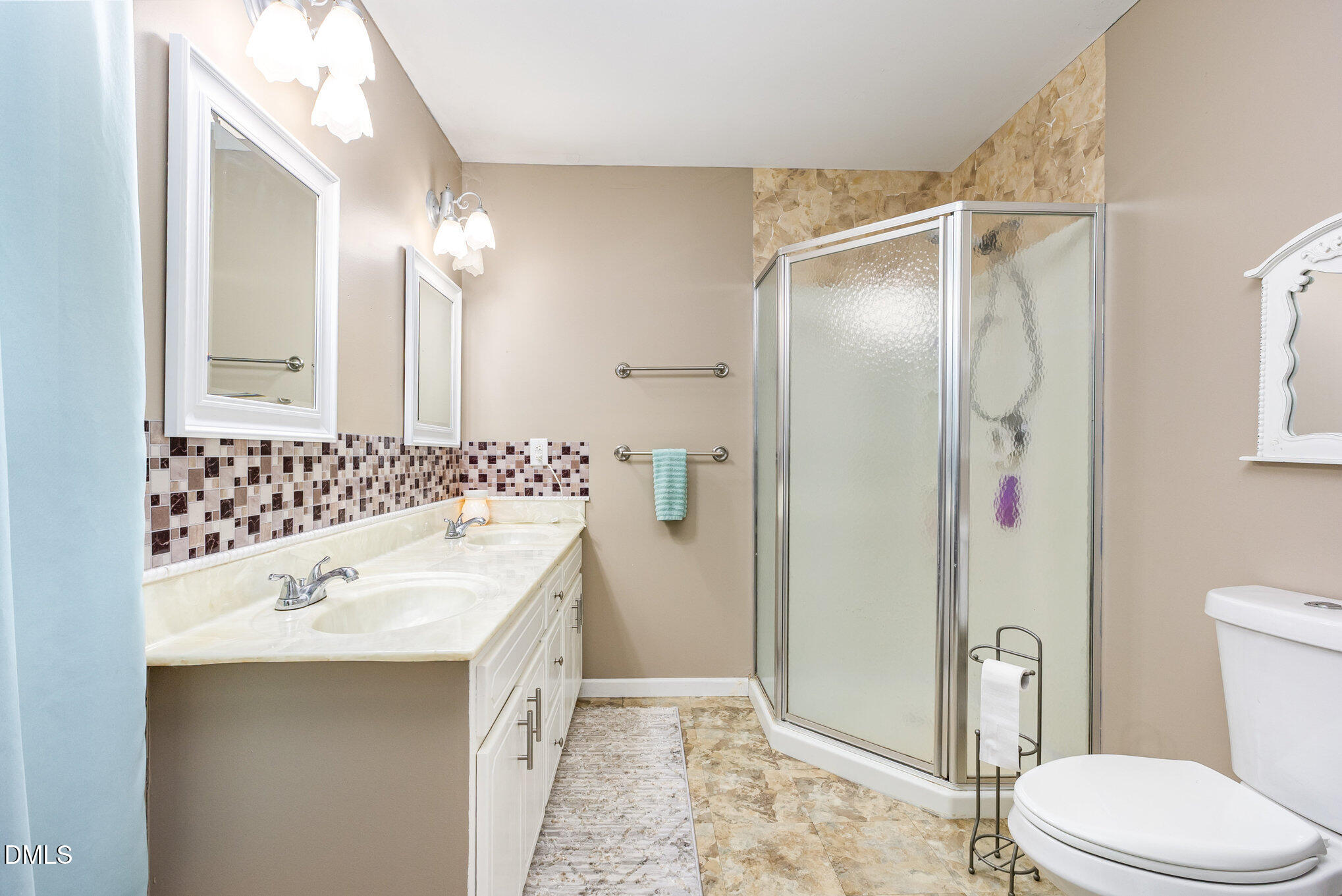 365 Landmark Road Willow Spring, NC 27592 - Photo 17 of 27 a bathroom with a sink a toilet and shower