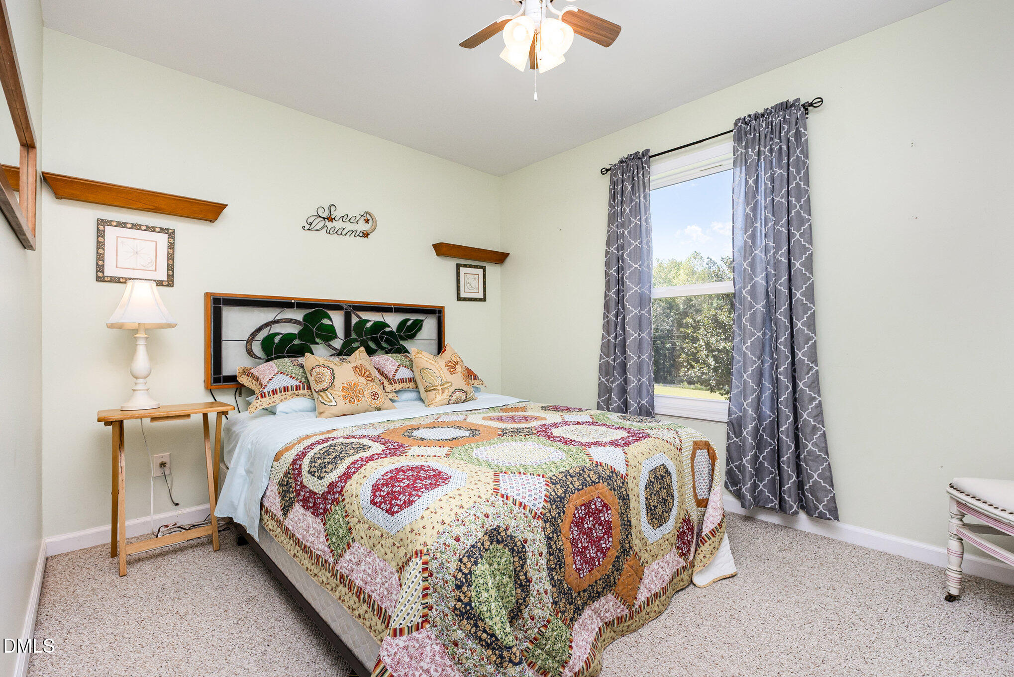 365 Landmark Road Willow Spring, NC 27592 - Photo 19 of 27 a bedroom with a bed and a window