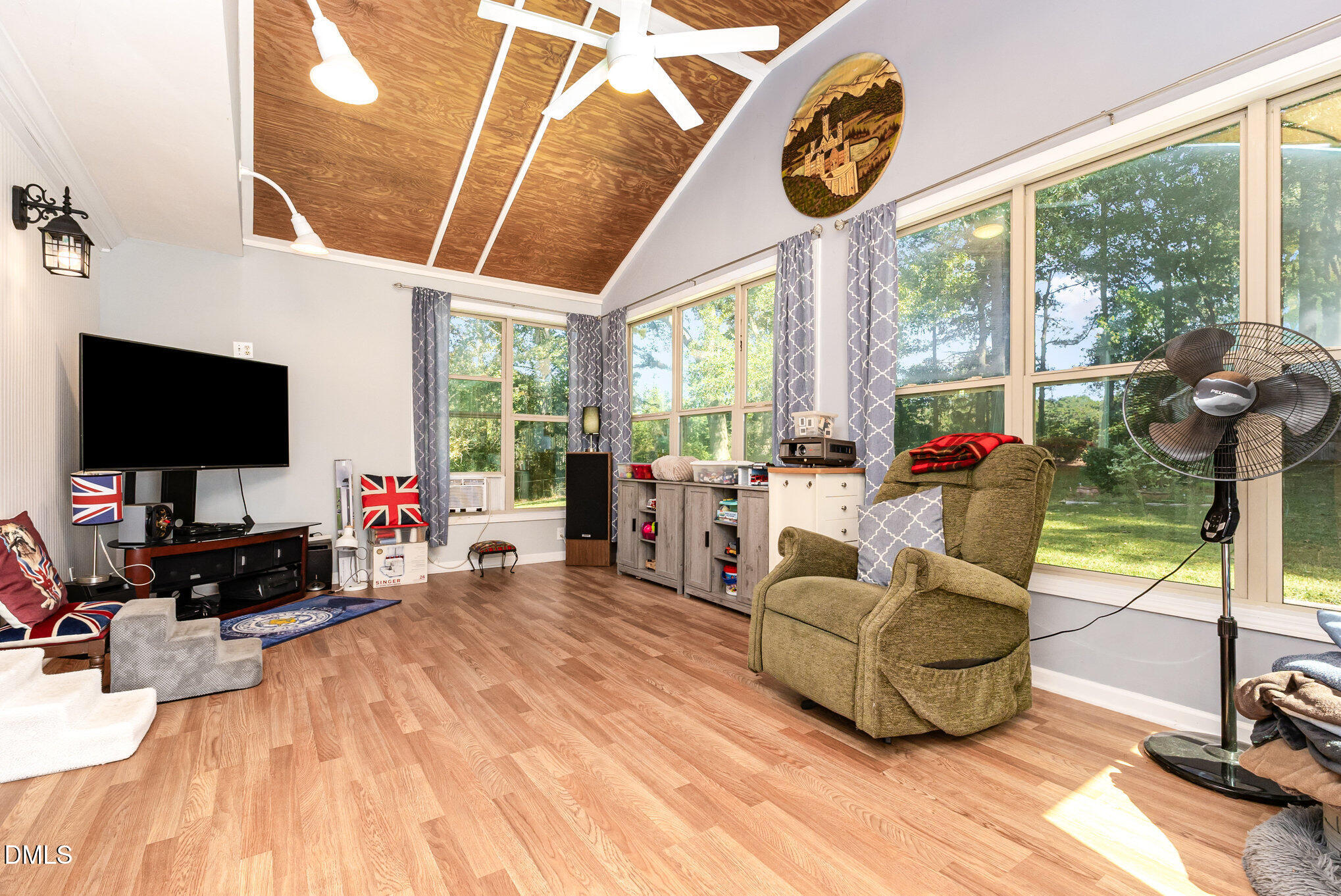 365 Landmark Road Willow Spring, NC 27592 - Photo 23 of 27 a living room with furniture and a flat screen tv