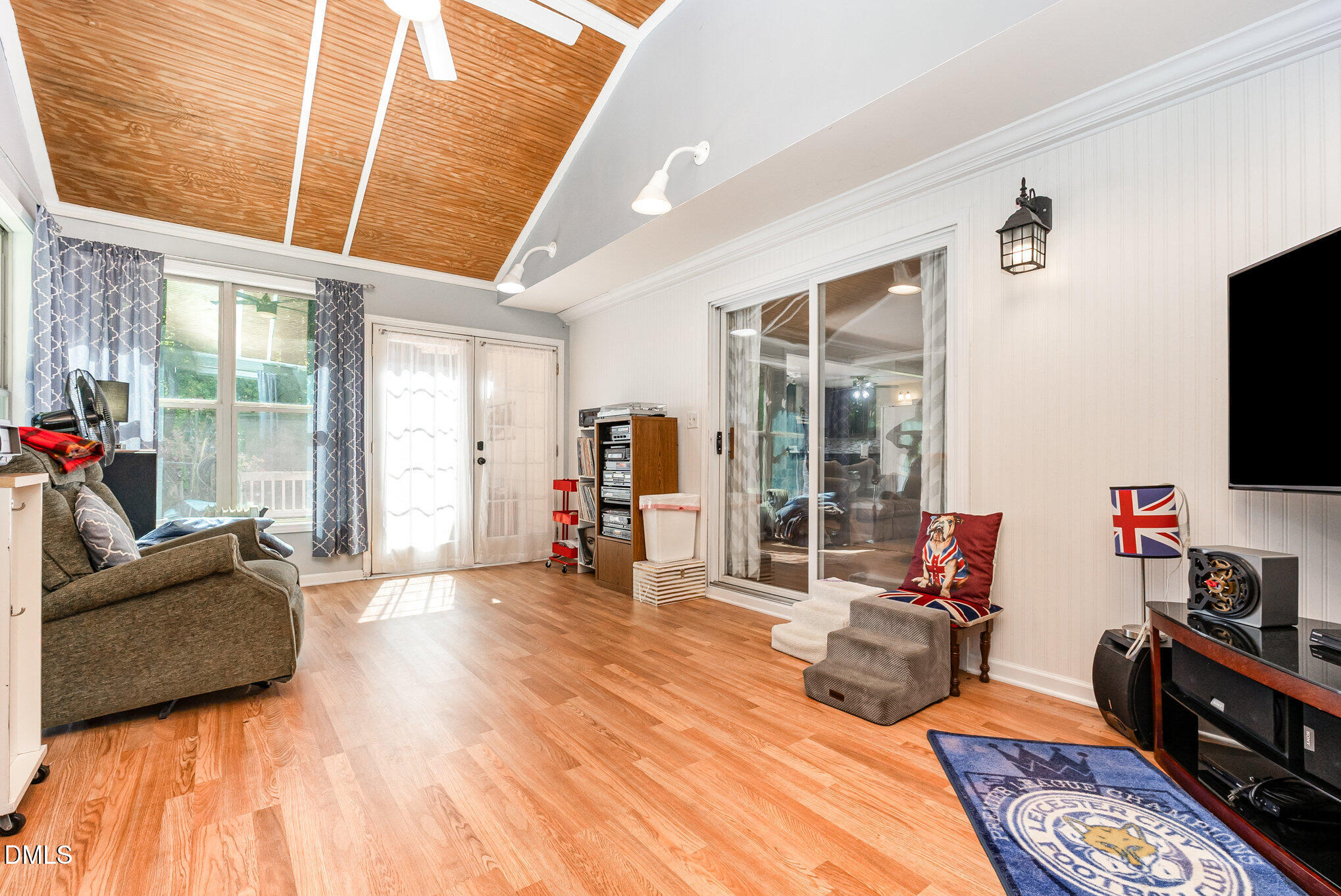 365 Landmark Road Willow Spring, NC 27592 - Photo 24 of 27 a bedroom with furniture and a flat screen tv