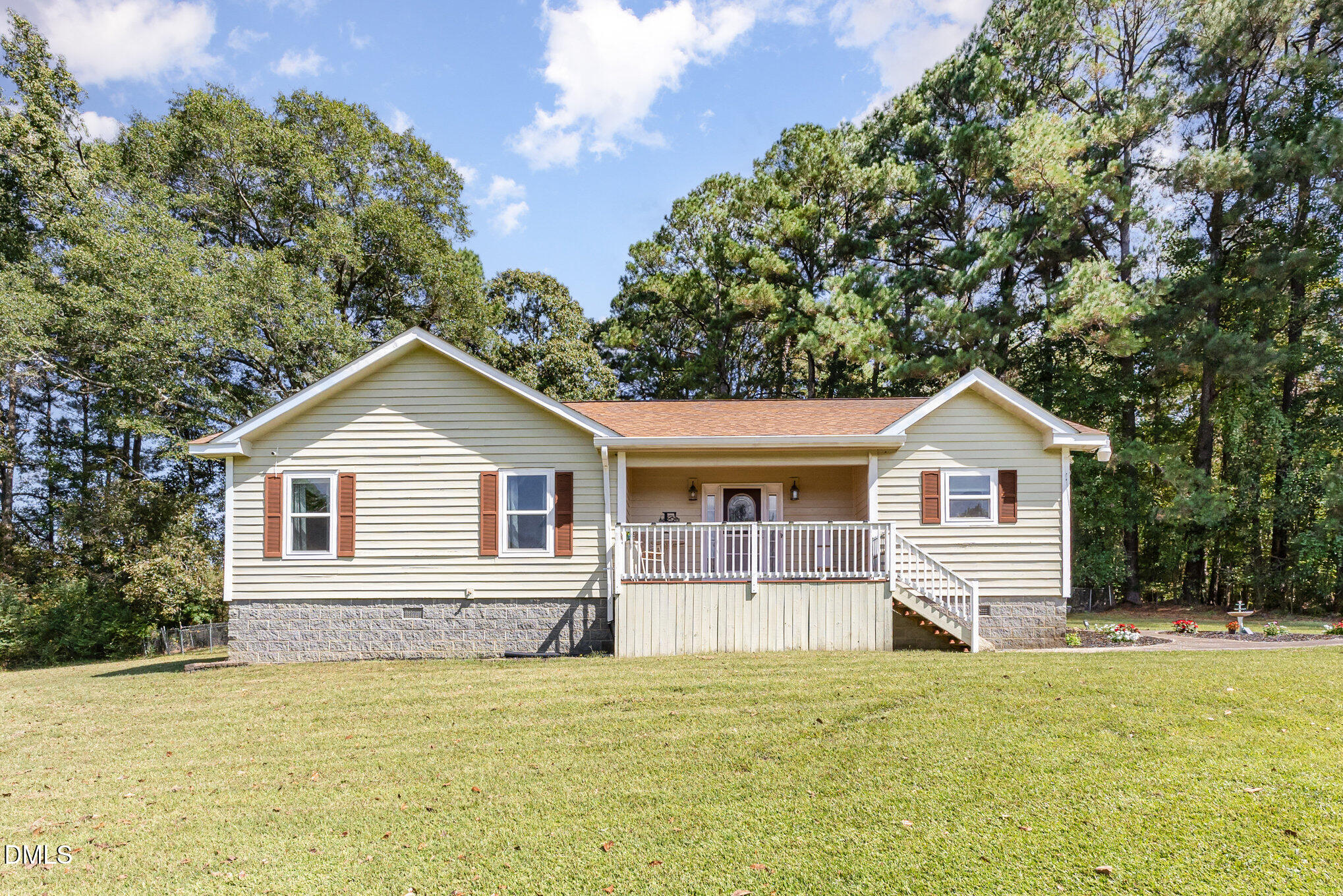 365 Landmark Road Willow Spring, NC 27592 - Photo 6 of 27 a front view of a house with a garden