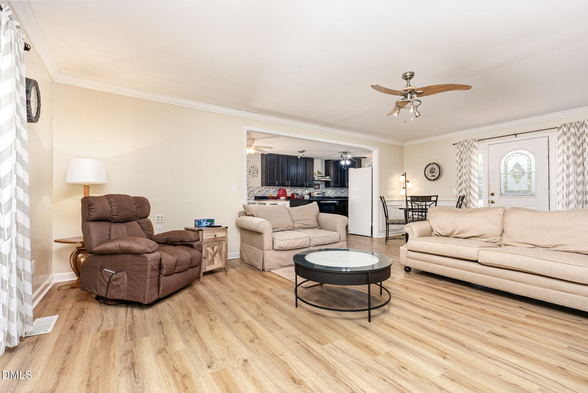 365 Landmark Road Willow Spring, NC 27592 - Photo 9 of 27 a living room with furniture and a wooden floor