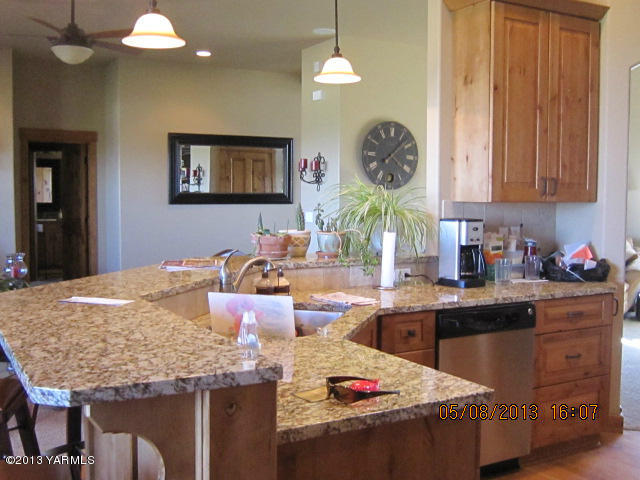 285 Cook Road Yakima, WA 98908 - Photo 13 of 26 a kitchen with a stove and a refrigerator