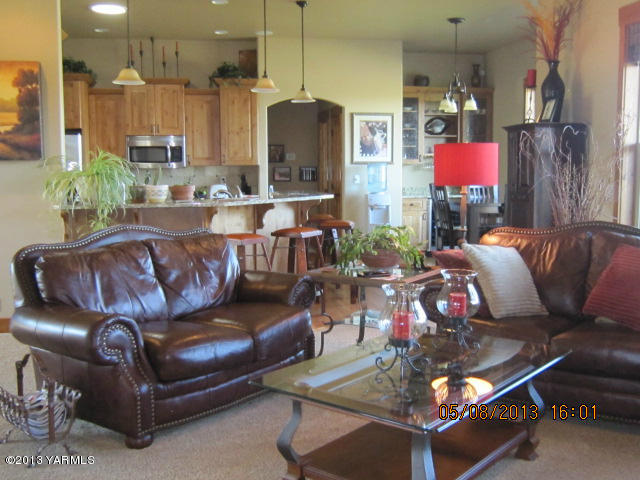 285 Cook Road Yakima, WA 98908 - Photo 9 of 26 a living room with furniture and a chandelier