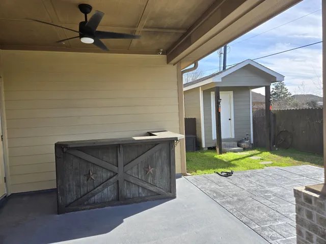 a view of a backyard with sitting area