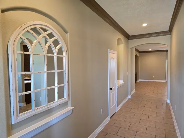a view of a livingroom with entryway and stairs