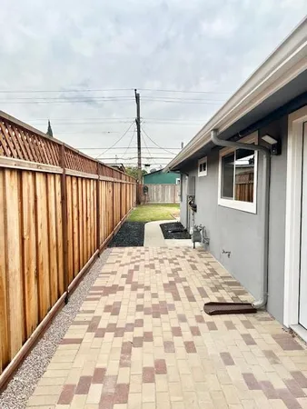 a view of backyard with green space