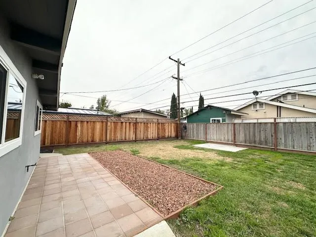 a view of a backyard of the house