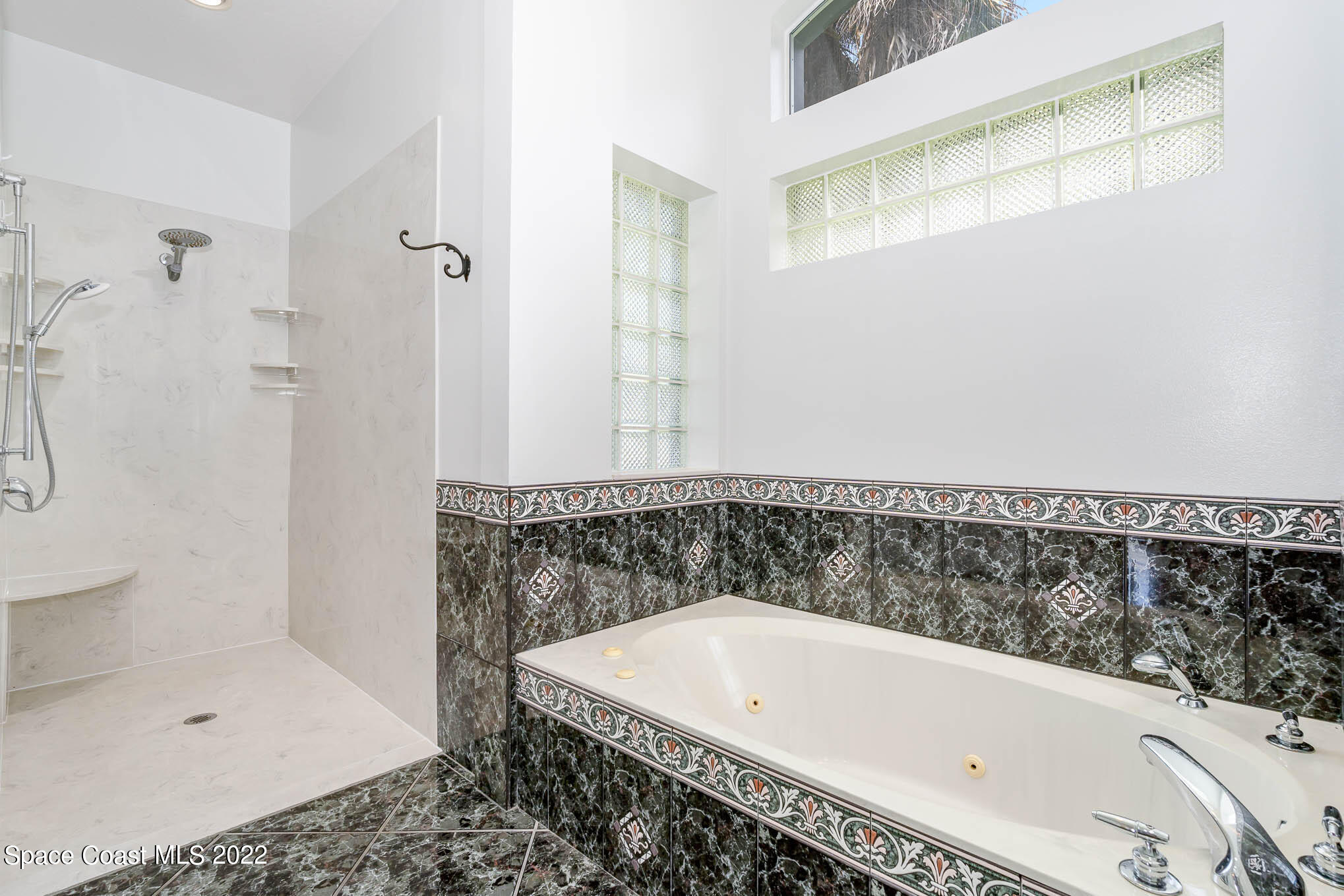 3920 Postridge Trail Melbourne, FL 32934 - Photo 16 of 52 a bathroom with a bathtub and a shower