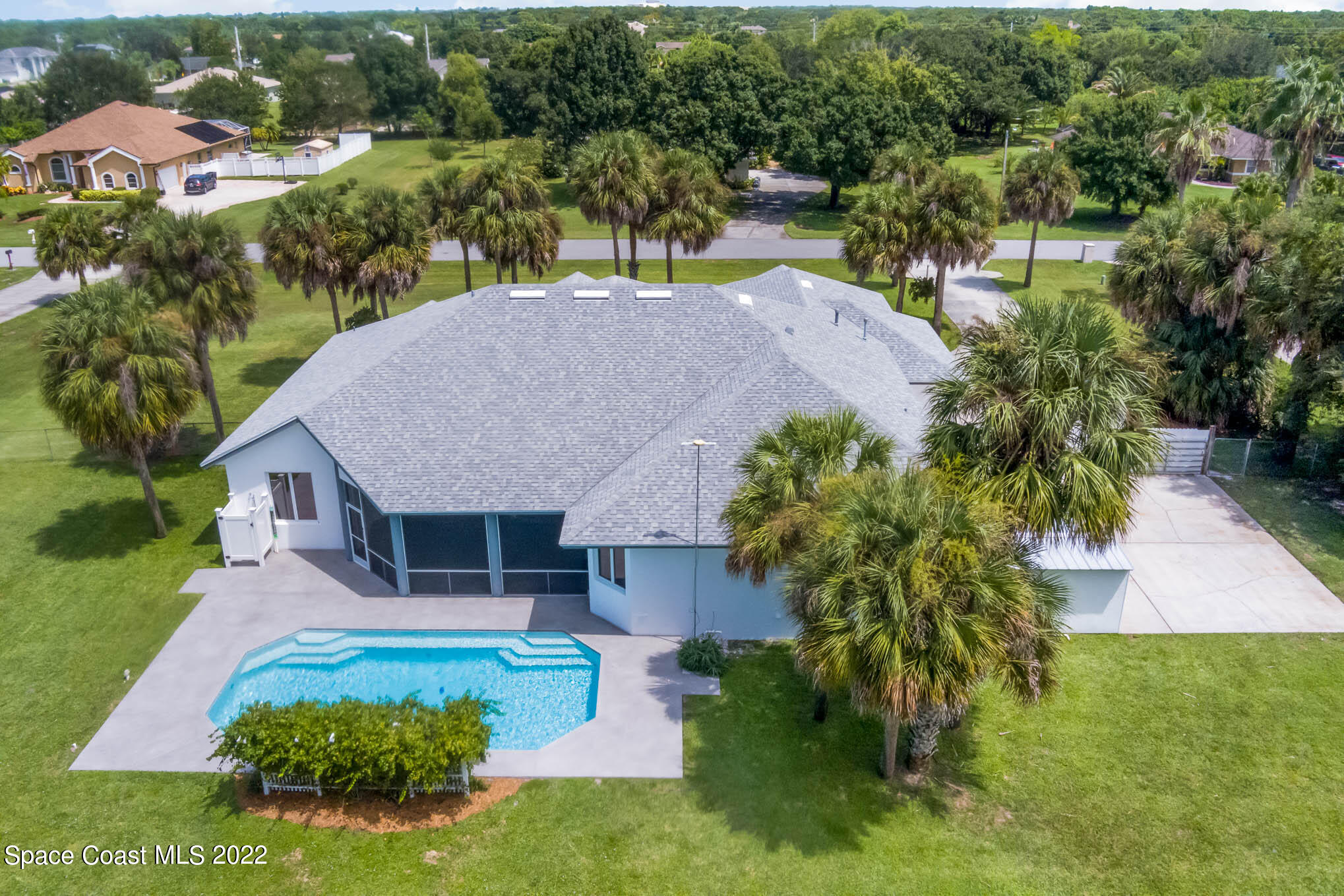 3920 Postridge Trail Melbourne, FL 32934 - Photo 2 of 52 an aerial view of a house with a yard basket ball court and outdoor seating