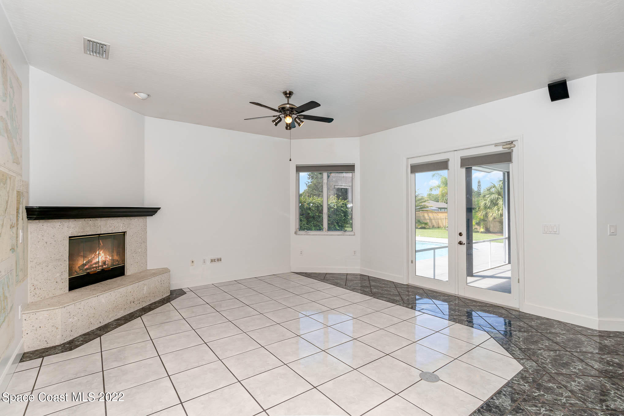 3920 Postridge Trail Melbourne, FL 32934 - Photo 26 of 52 a view of an empty room with window and fire place