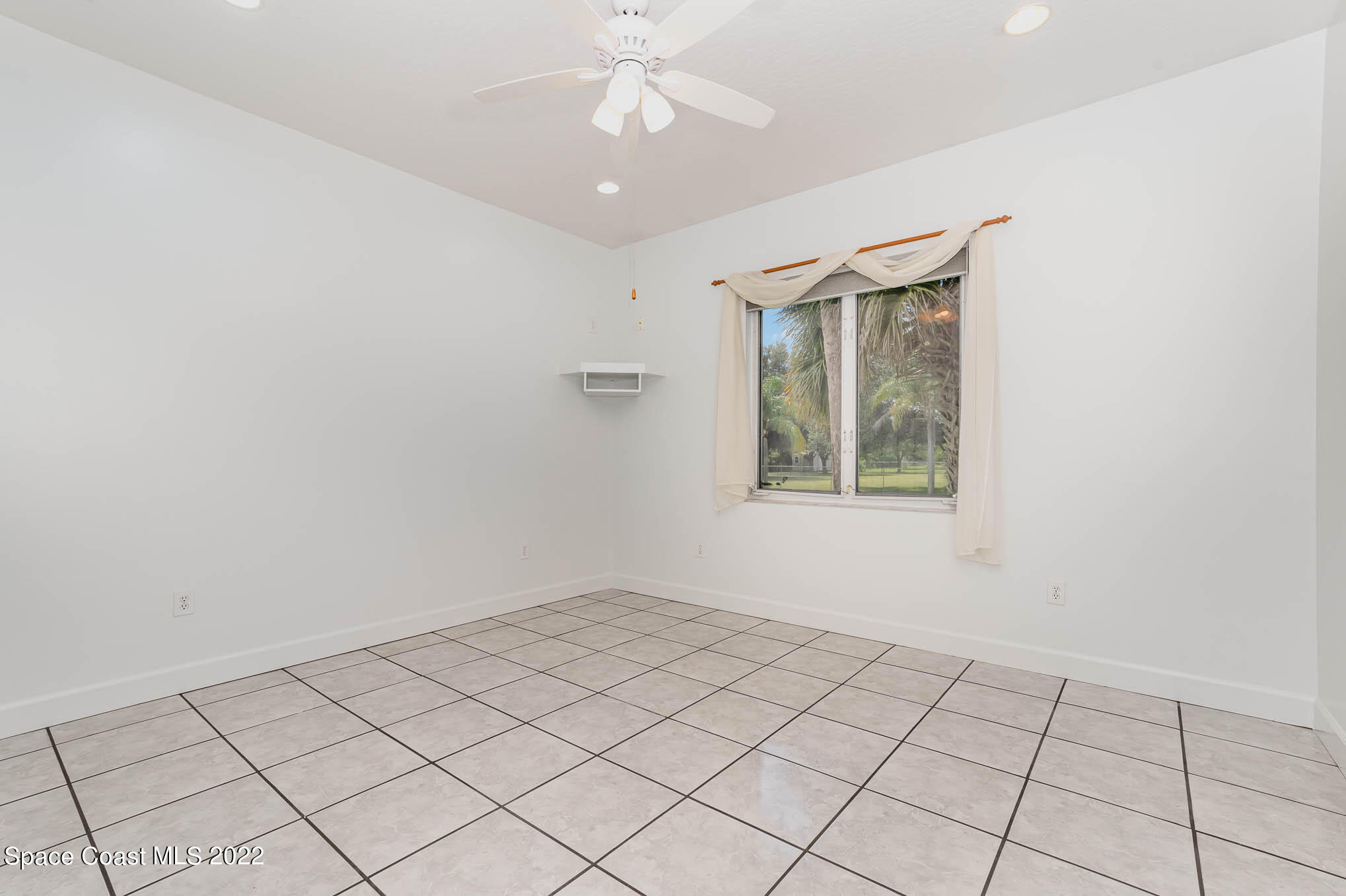 3920 Postridge Trail Melbourne, FL 32934 - Photo 28 of 52 a view of an empty room with a window