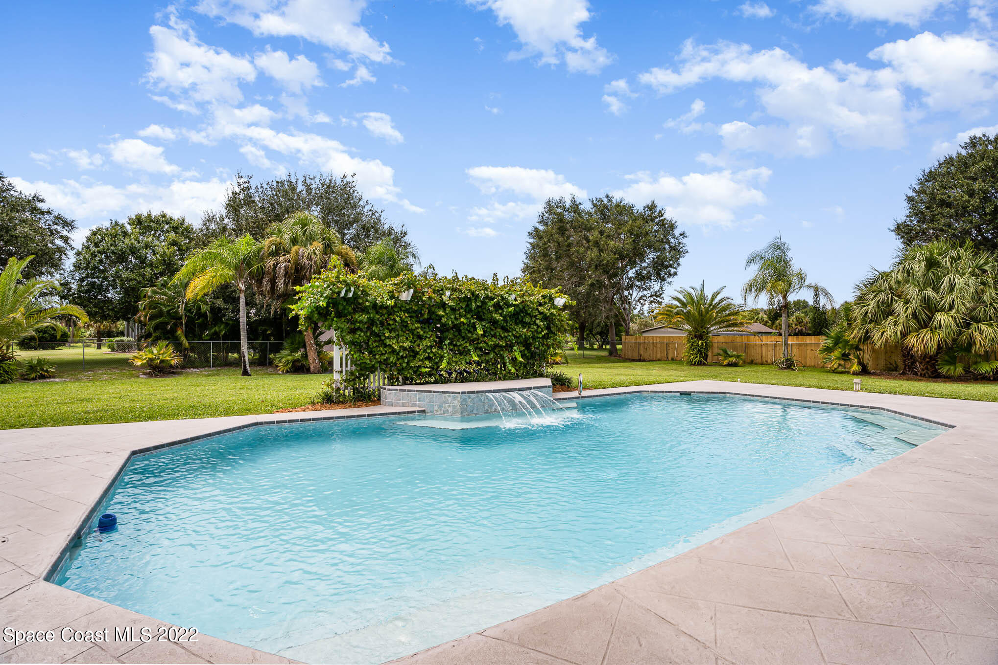 3920 Postridge Trail Melbourne, FL 32934 - Photo 3 of 52 a view of a swimming pool and a yard