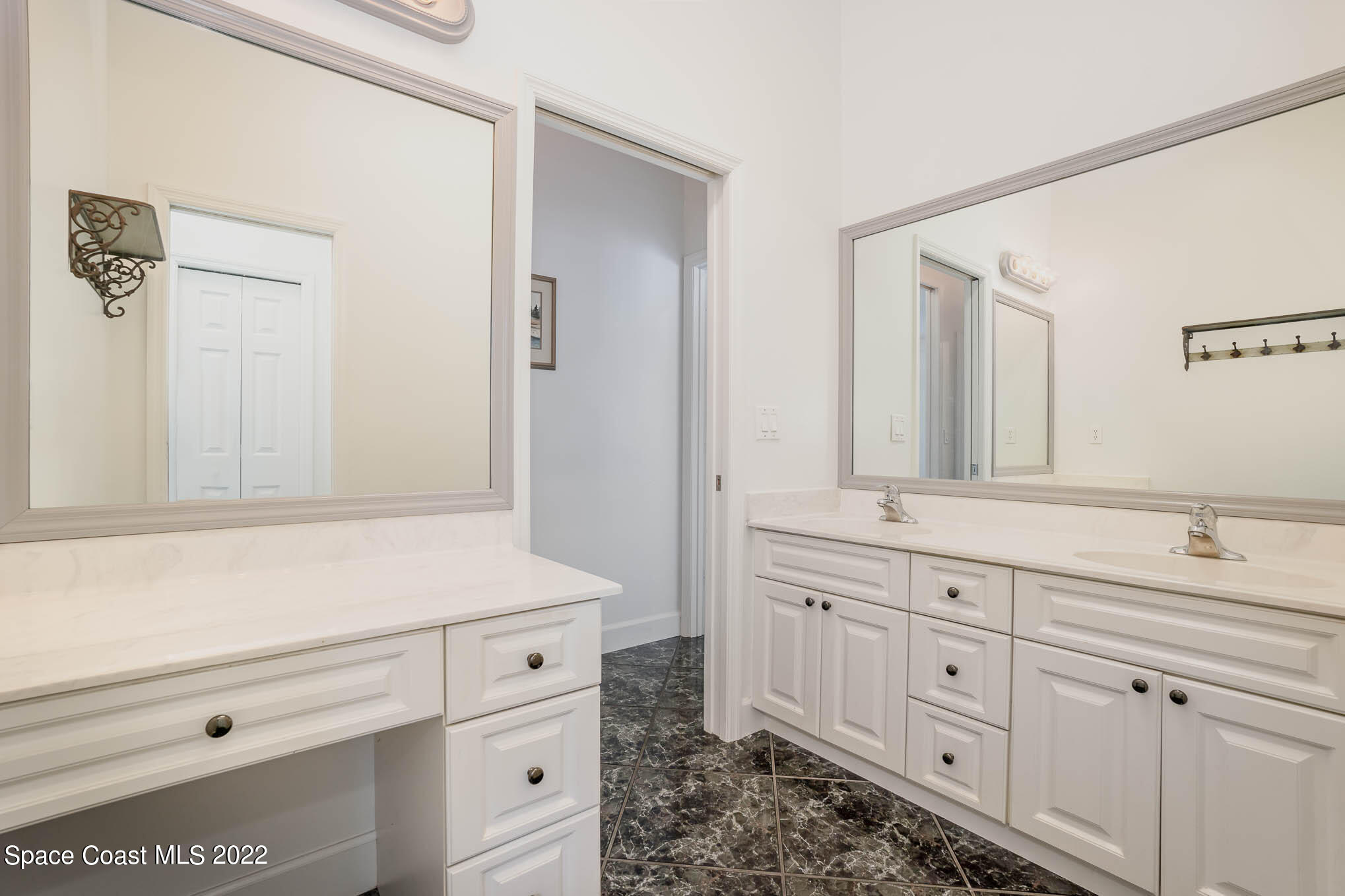3920 Postridge Trail Melbourne, FL 32934 - Photo 33 of 52 a bathroom with a sink and a mirror
