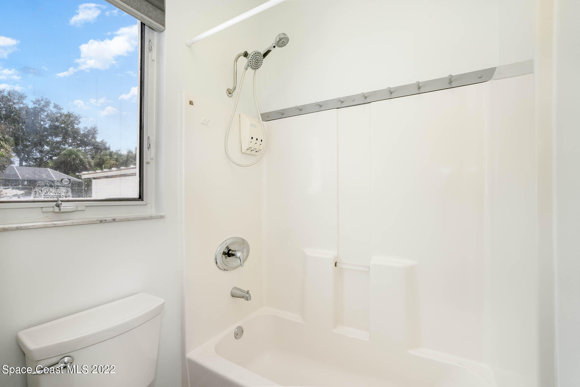 3920 Postridge Trail Melbourne, FL 32934 - Photo 34 of 52 a bath room with a toilet a bath tub and a shower