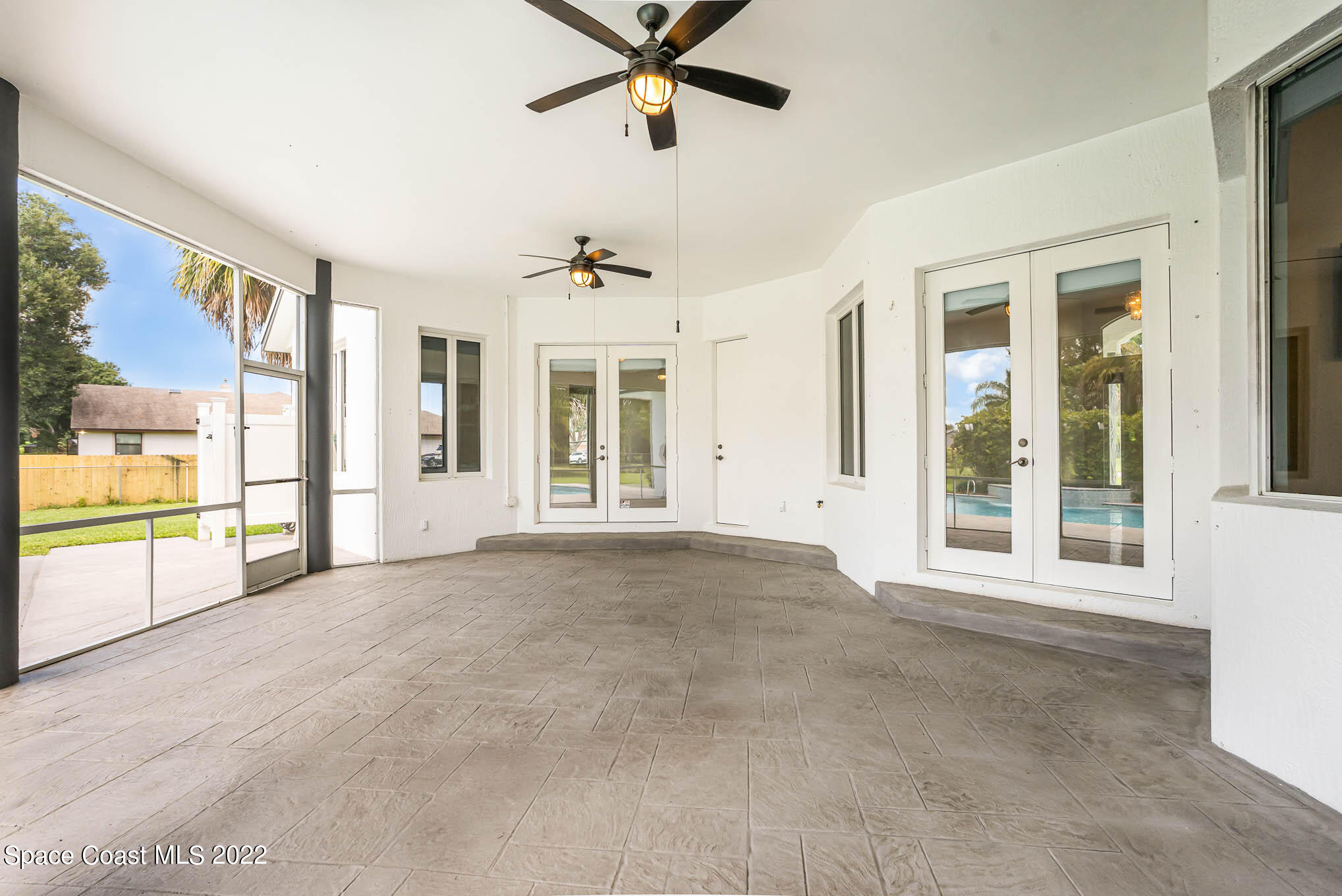 3920 Postridge Trail Melbourne, FL 32934 - Photo 36 of 52 a view of a livingroom with a ceiling fan and window