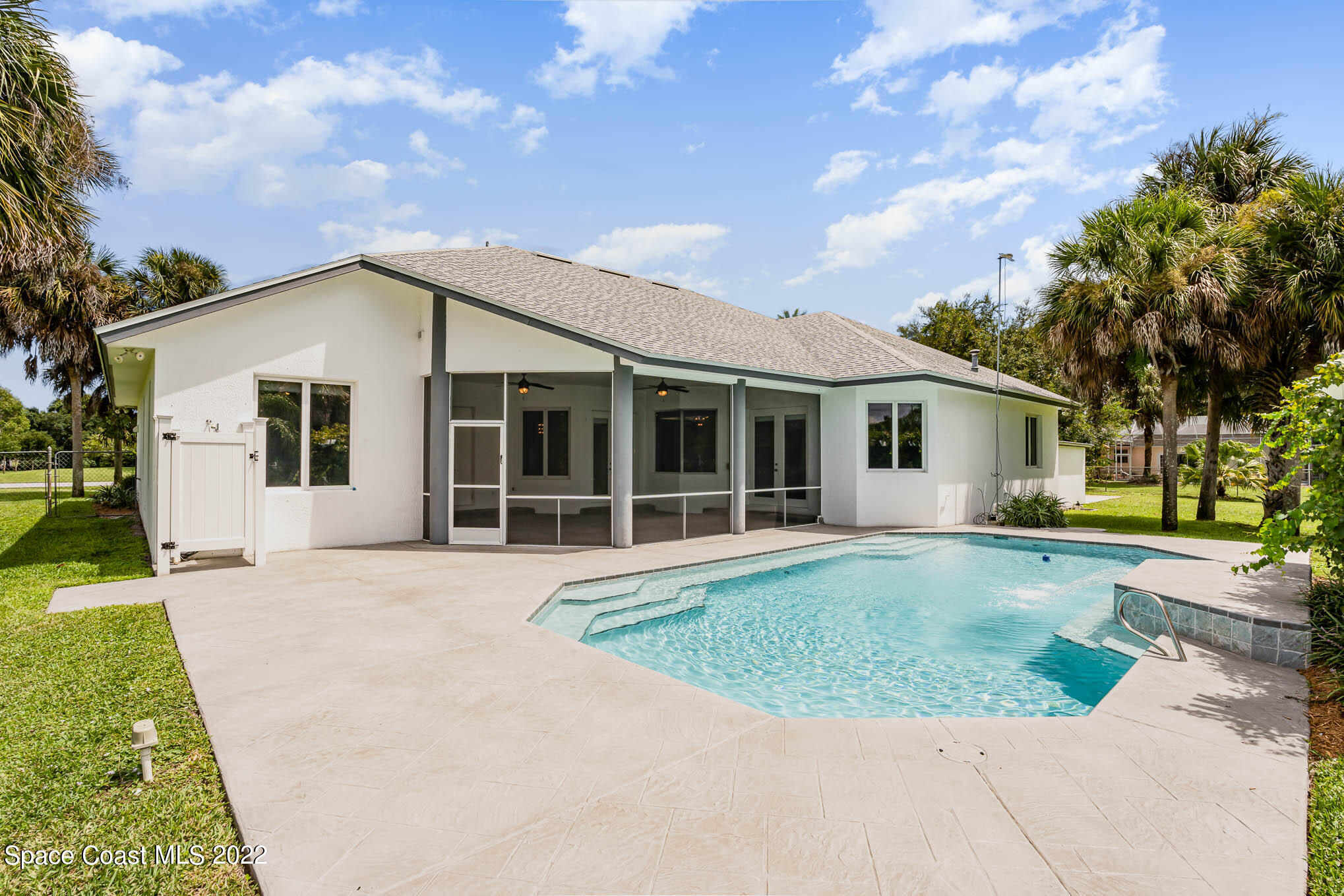 3920 Postridge Trail Melbourne, FL 32934 - Photo 38 of 52 a front view of a house with a garden and outdoor seating