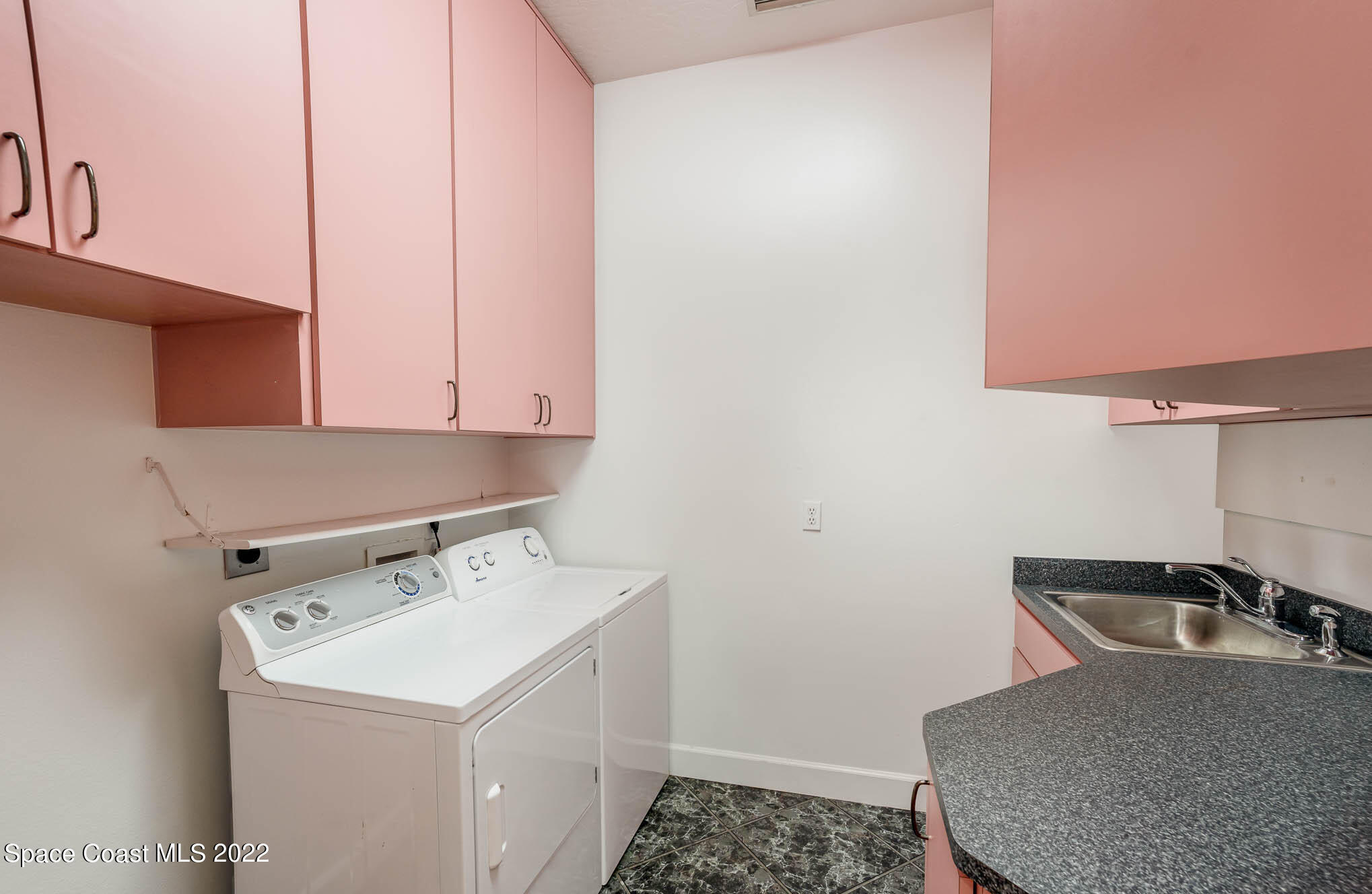 3920 Postridge Trail Melbourne, FL 32934 - Photo 41 of 52 a utility room with a sink a washer and dryer