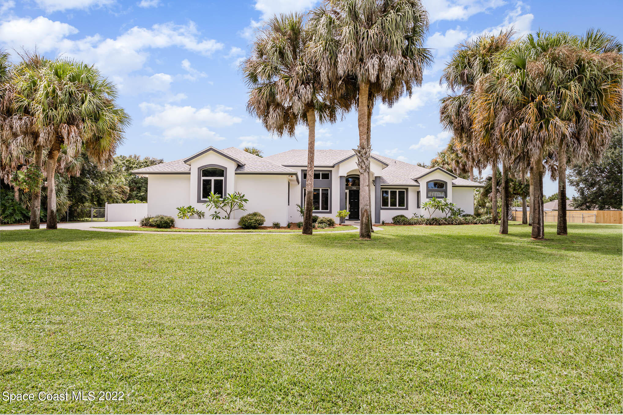 3920 Postridge Trail Melbourne, FL 32934 - Photo 44 of 52 a front view of house with yard and green space