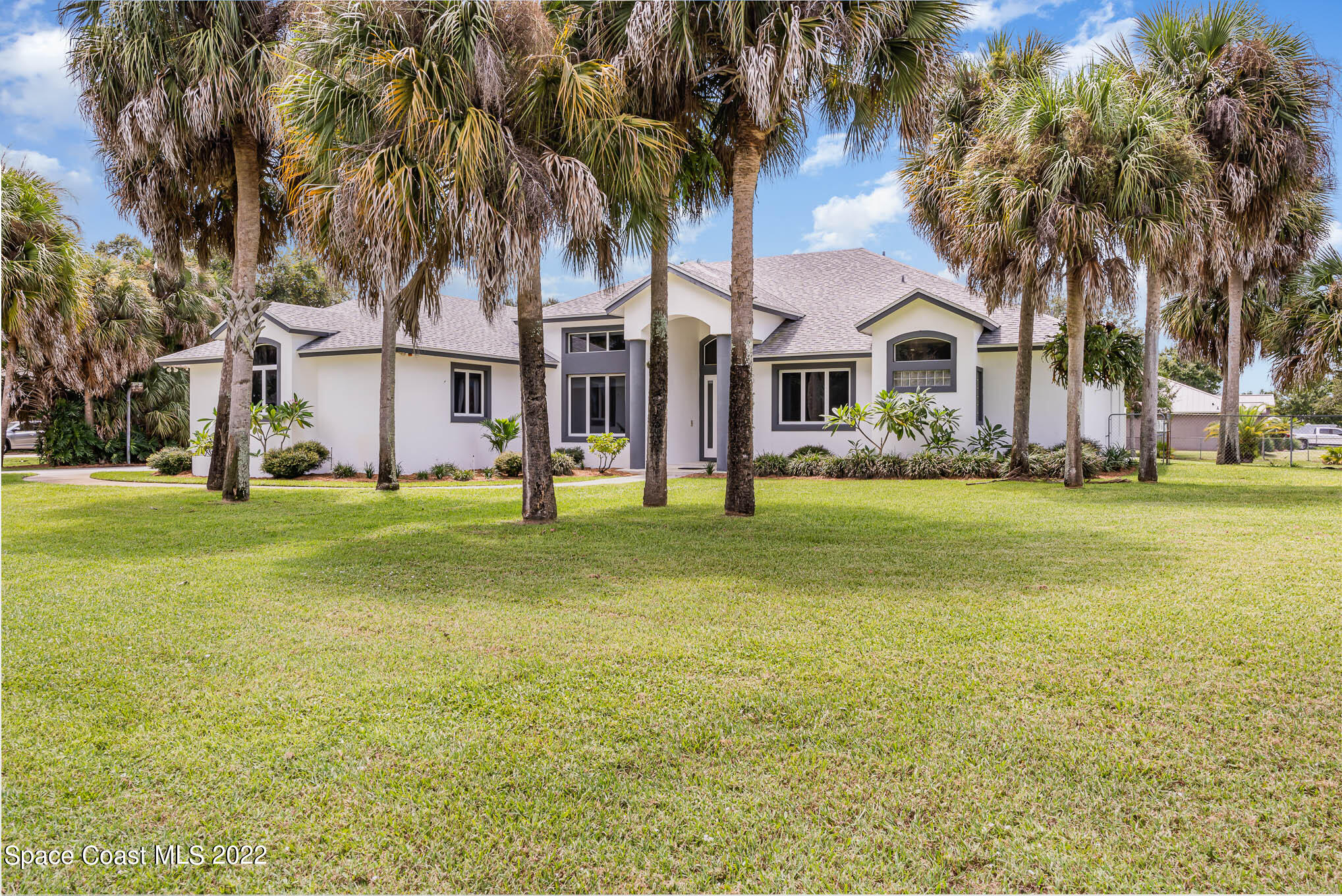 3920 Postridge Trail Melbourne, FL 32934 - Photo 46 of 52 a front view of house with yard and green space