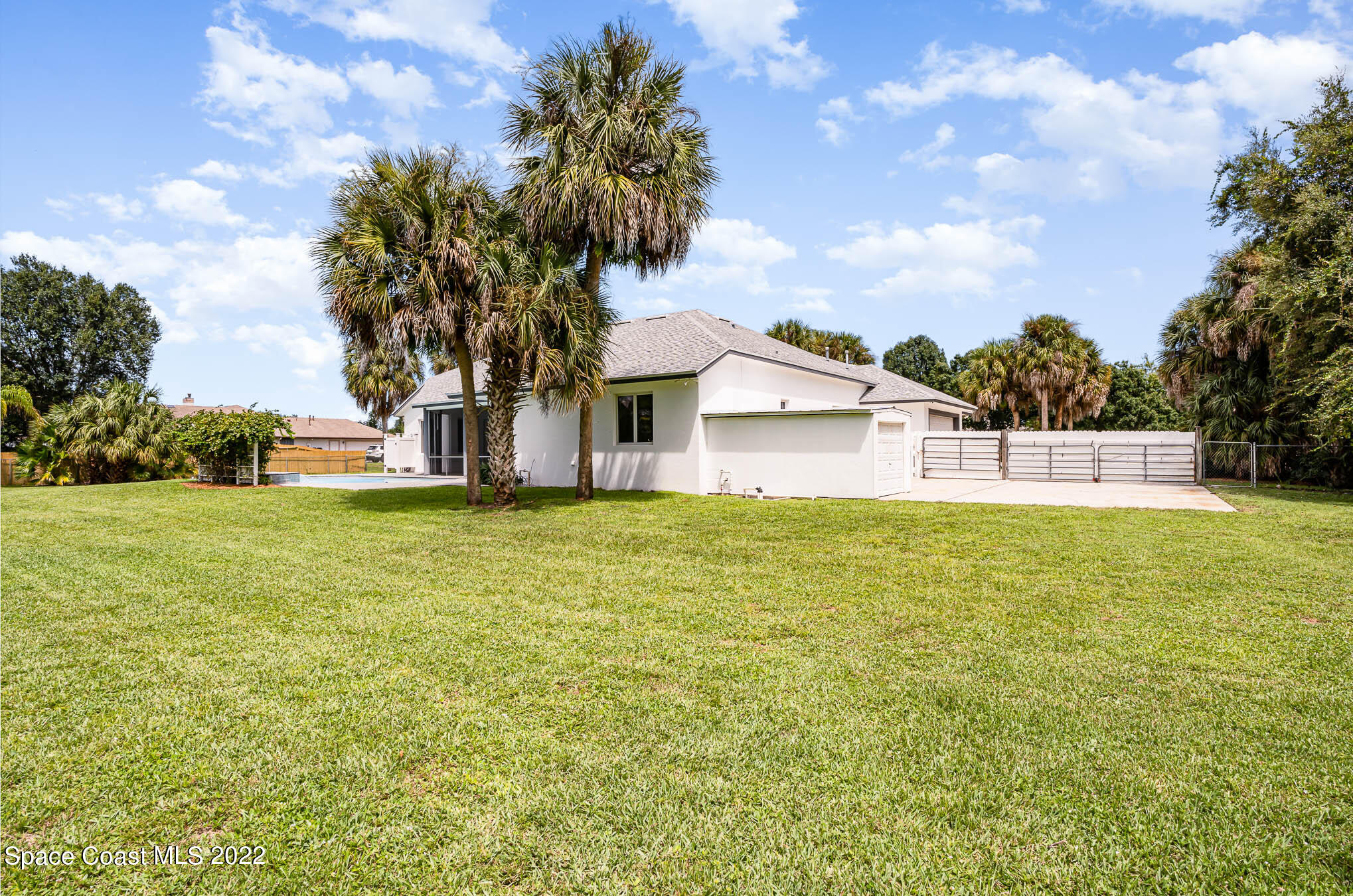 3920 Postridge Trail Melbourne, FL 32934 - Photo 49 of 52 a view of a house with a yard and garage