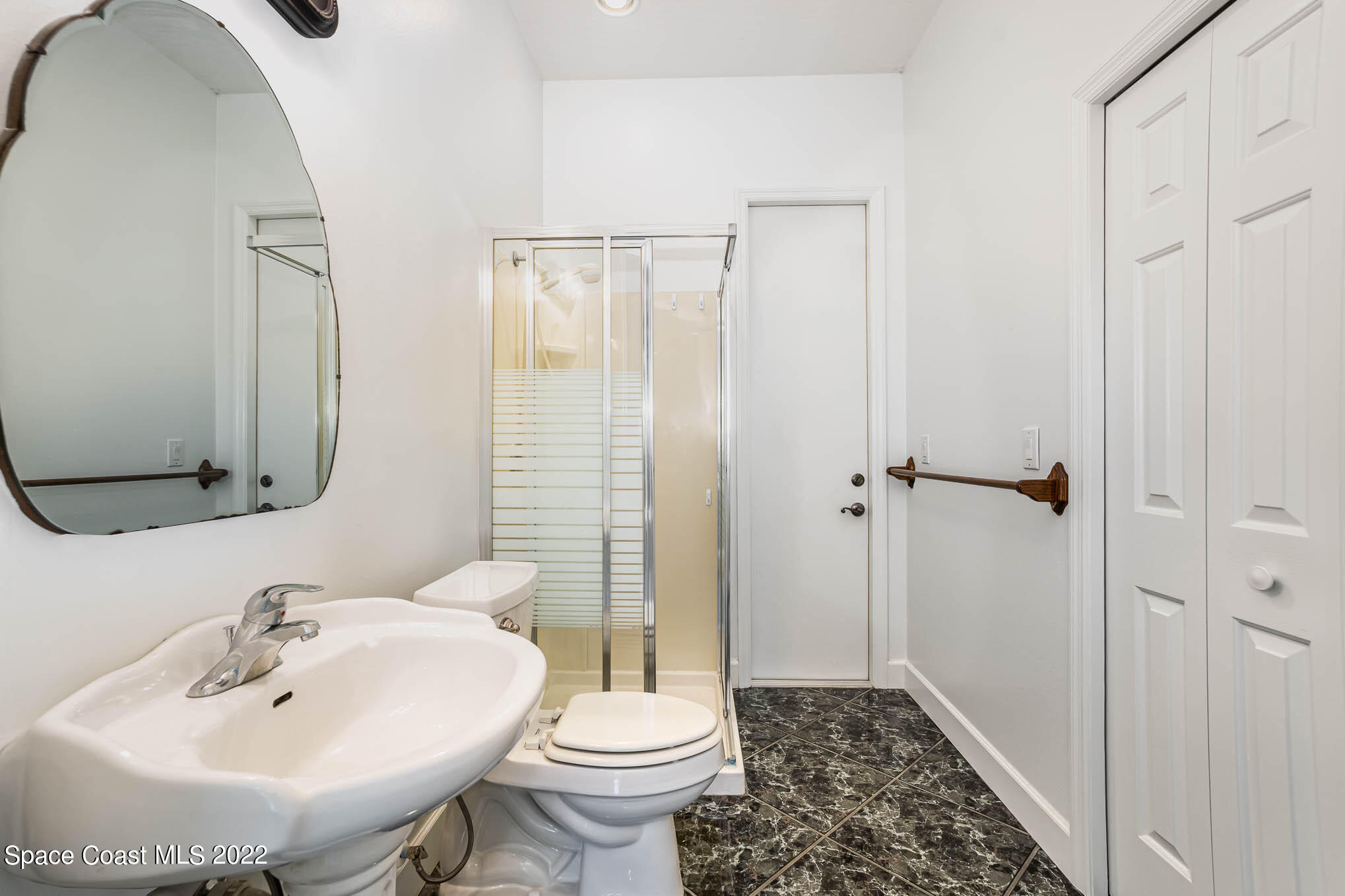 3920 Postridge Trail Melbourne, FL 32934 - Photo 9 of 52 a bathroom with a sink toilet and shower