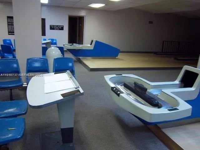 a living room with furniture and a chair