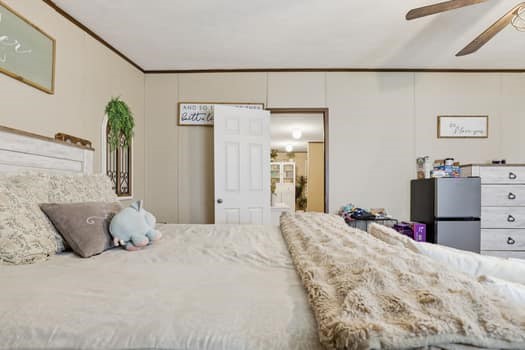 12947 Ralston Drive Conroe, TX 77306 - Photo 15 of 24 a bedroom with a bed and dresser