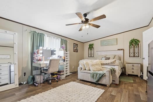 12947 Ralston Drive Conroe, TX 77306 - Photo 16 of 24 a bedroom with furniture and a chandelier