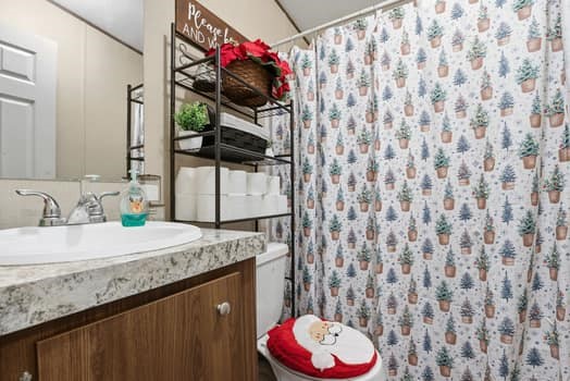 12947 Ralston Drive Conroe, TX 77306 - Photo 20 of 24 a bathroom with a granite countertop sink and a mirror