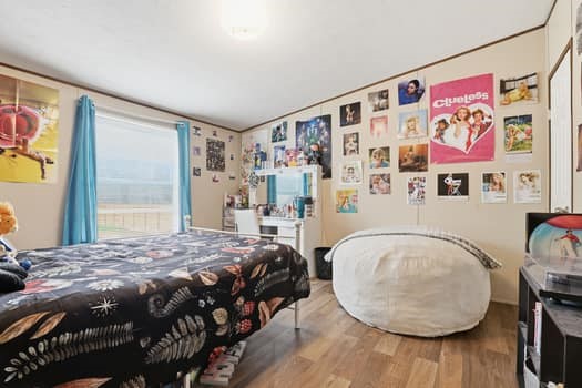 12947 Ralston Drive Conroe, TX 77306 - Photo 23 of 24 a bedroom with a bed and a window