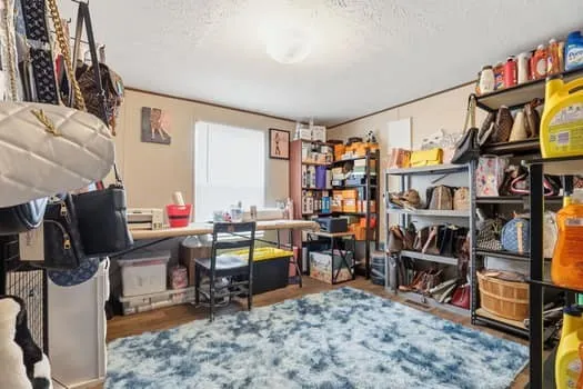 a view of a workspace with furniture and toys