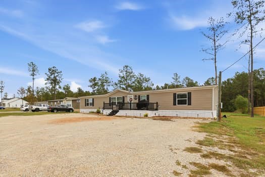 12947 Ralston Drive Conroe, TX 77306 - Photo 4 of 24 a swimming pool with outdoor seating and yard