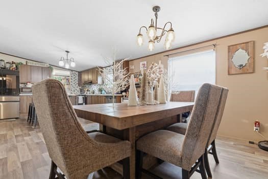 12947 Ralston Drive Conroe, TX 77306 - Photo 10 of 24 a view of a dining room with furniture window and wooden floor