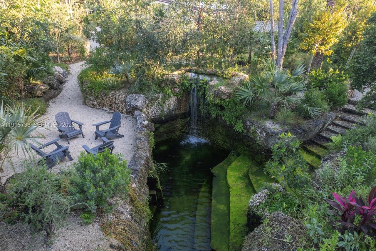 12050 Moss Ranch Road Pinecrest, FL 33156 - Photo 33 of 33 an aerial view of a house with a yard
