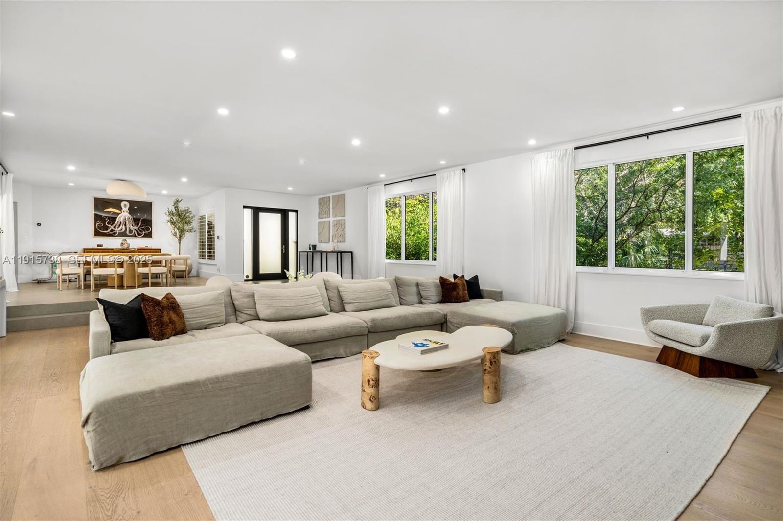 12050 Moss Ranch Road Pinecrest, FL 33156 - Photo 4 of 27 a living room with furniture and a large window