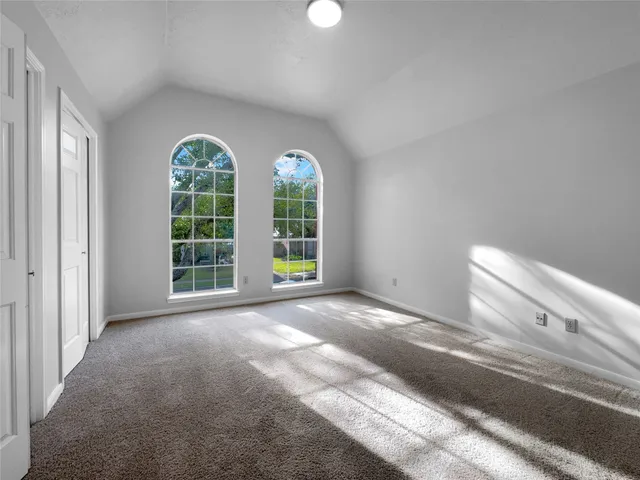 a view of a livingroom with windows