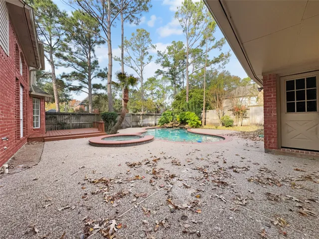 a view of a yard with a tree
