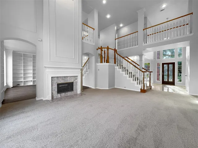 a view of empty room with fireplace