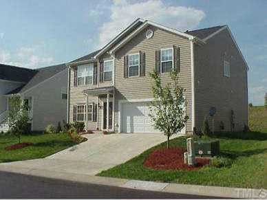 405 Hanson Road Durham, NC 27713 - Photo 1 of 1 a front view of a house with garden