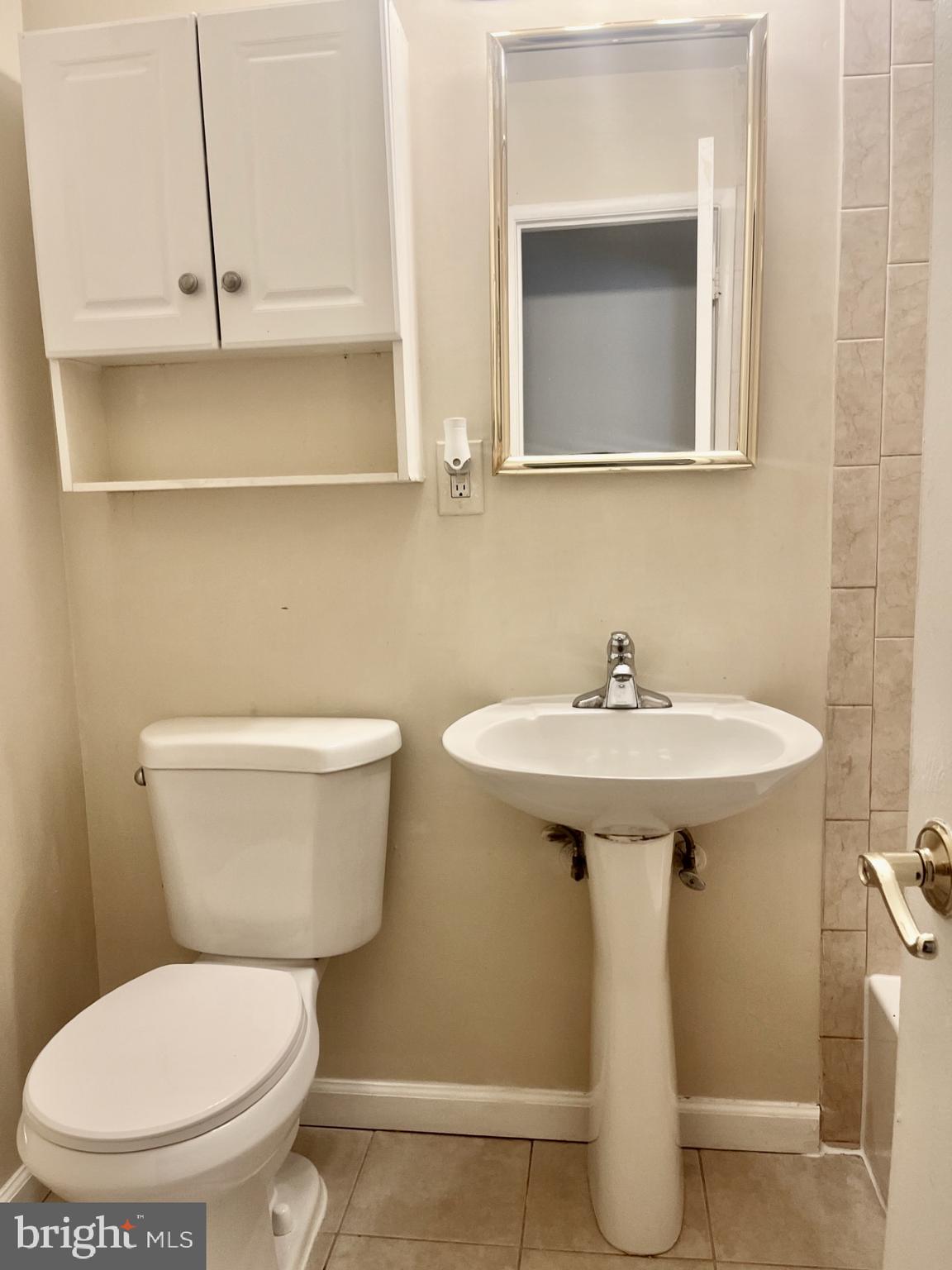 2250 Southgate Square Reston, VA 20191 - Photo 17 of 21 a white toilet sitting next to a bathroom sink