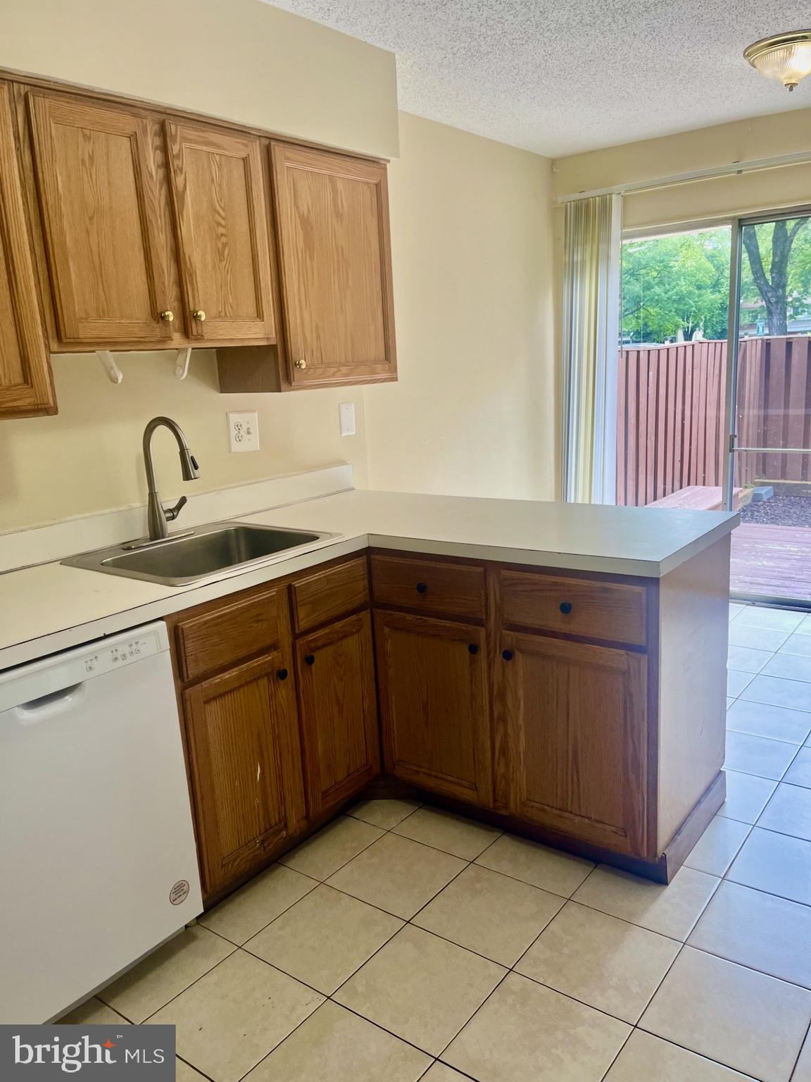 2250 Southgate Square Reston, VA 20191 - Photo 6 of 21 a kitchen with a sink stove and cabinets
