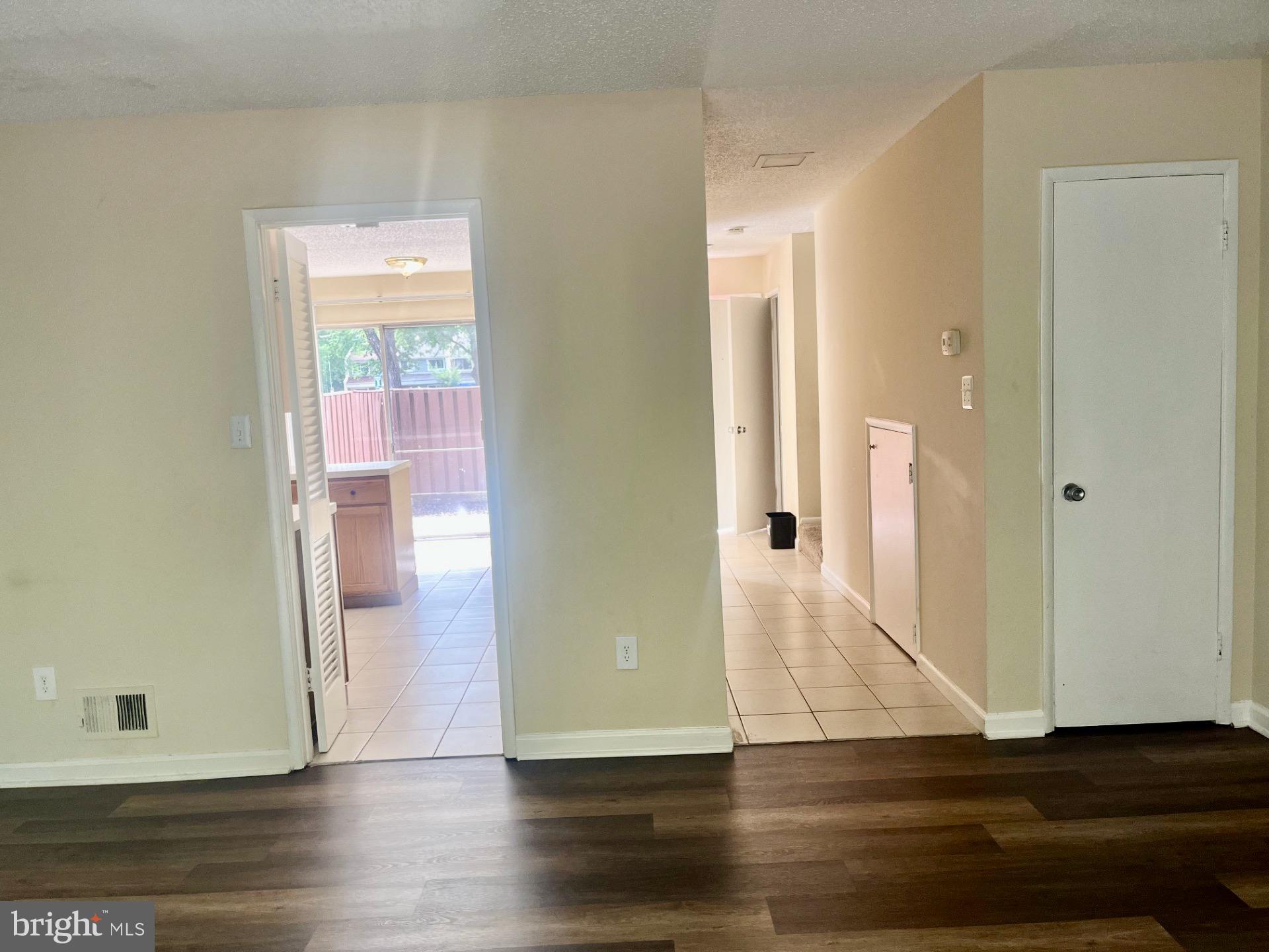 2250 Southgate Square Reston, VA 20191 - Photo 10 of 21 an empty room with wooden floor and entrance