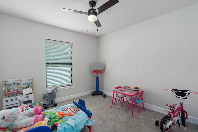 a bedroom with furniture a bed and a window