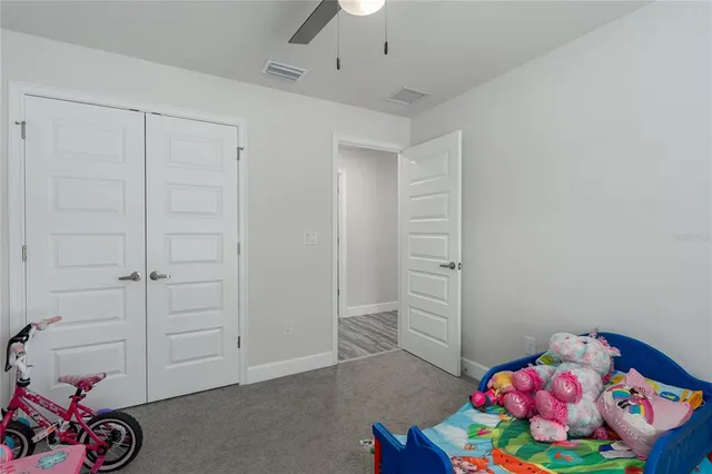 a room with toys and dresser